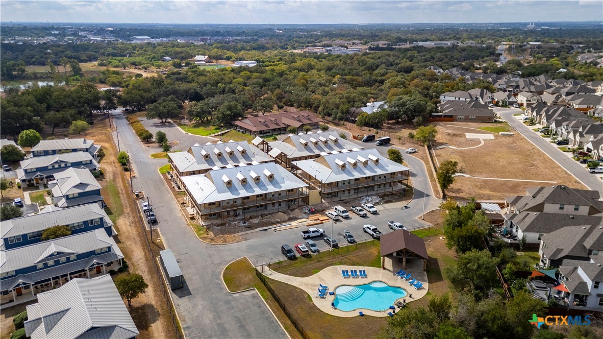 1554 Gruene Road, Unit A10 New Braunfels, TX 78130 - Photo 28 of 32 an aerial view of residential houses with outdoor space