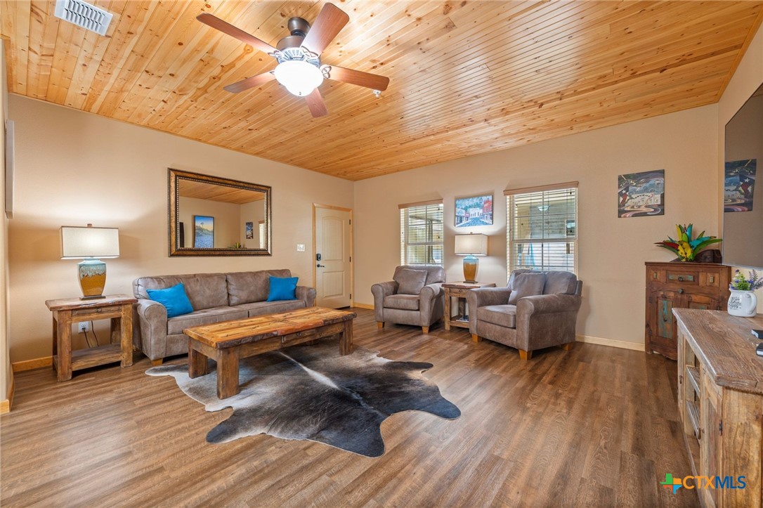 1554 Gruene Road, Unit A10 New Braunfels, TX 78130 - Photo 5 of 32 a living room with furniture and a wooden floor