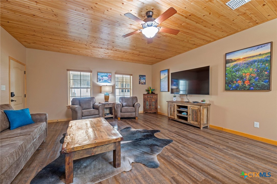 1554 Gruene Road, Unit A10 New Braunfels, TX 78130 - Photo 6 of 32 a living room with furniture and a flat screen tv
