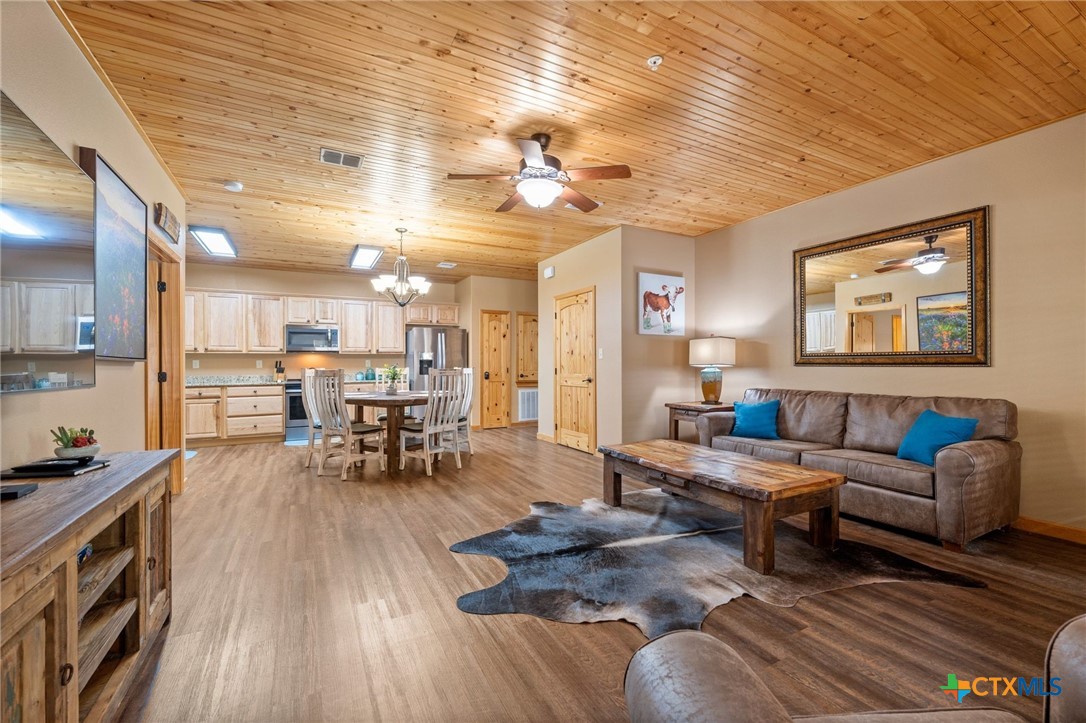 1554 Gruene Road, Unit A10 New Braunfels, TX 78130 - Photo 7 of 32 a living room with furniture and wooden floor