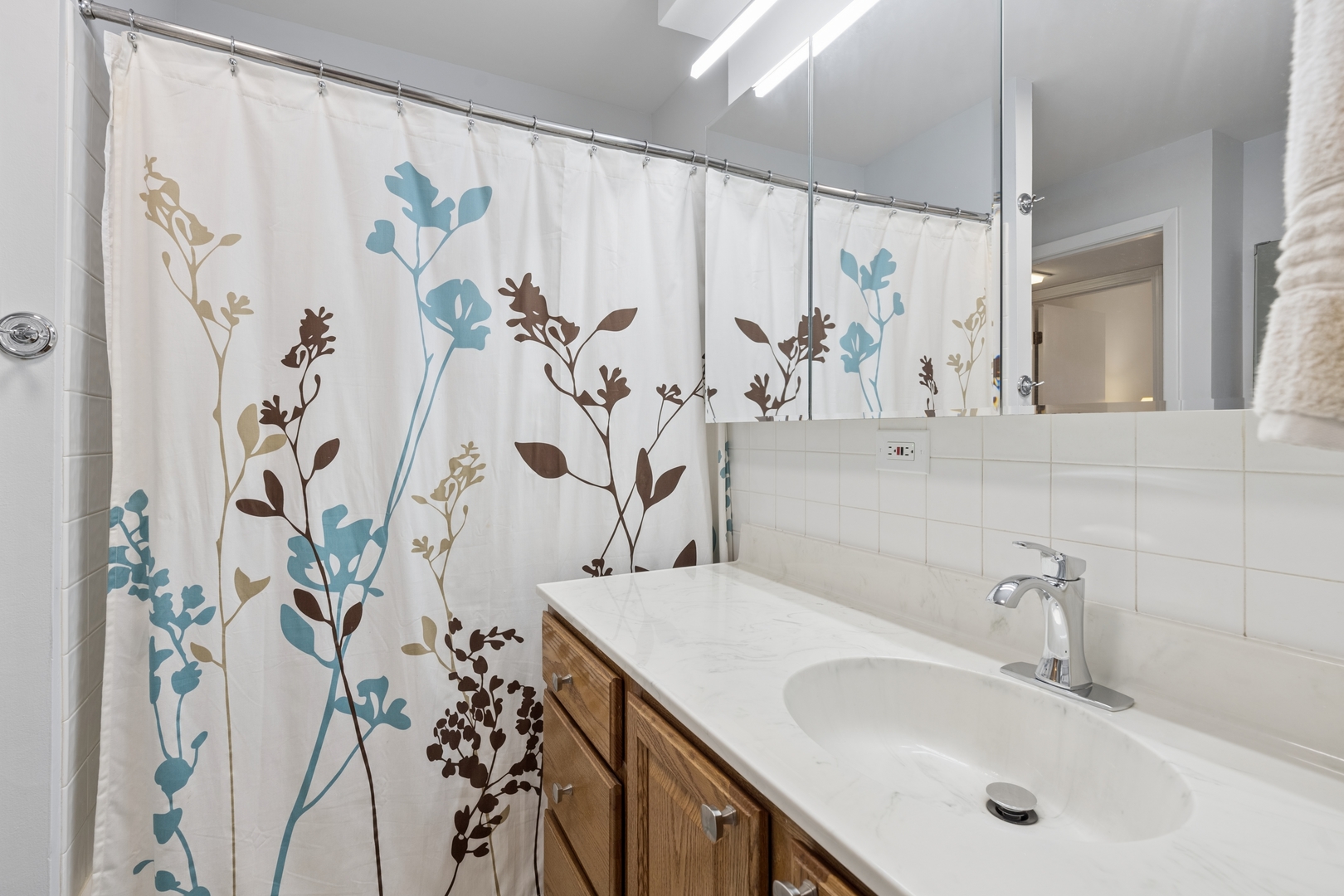 1122 West Altgeld Street, Unit 12 Chicago, IL 60614 - Photo 13 of 20 a bathroom with a sink and mirror with toilet