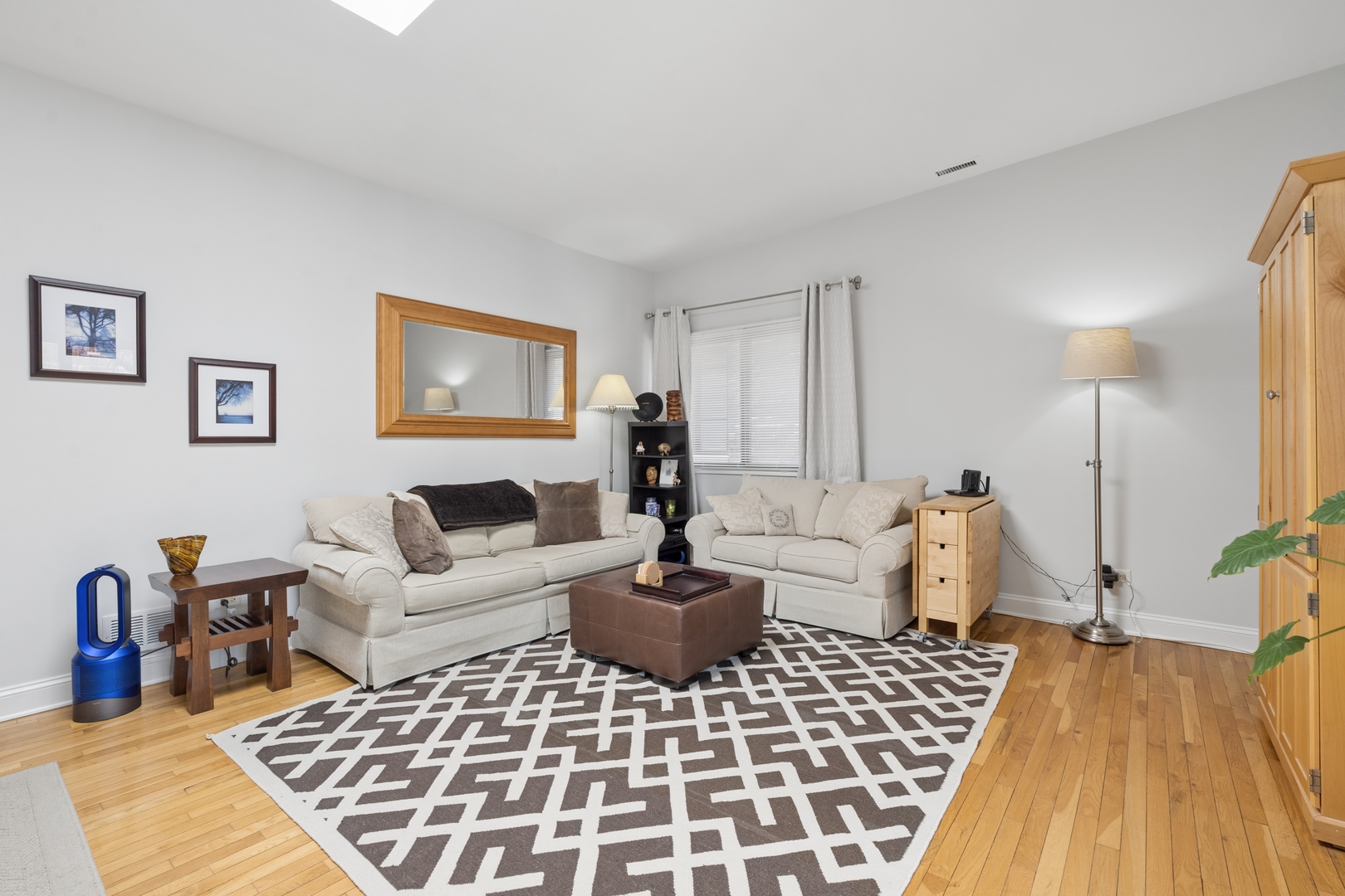 1122 West Altgeld Street, Unit 12 Chicago, IL 60614 - Photo 4 of 20 a living room with furniture a lamp and a rug