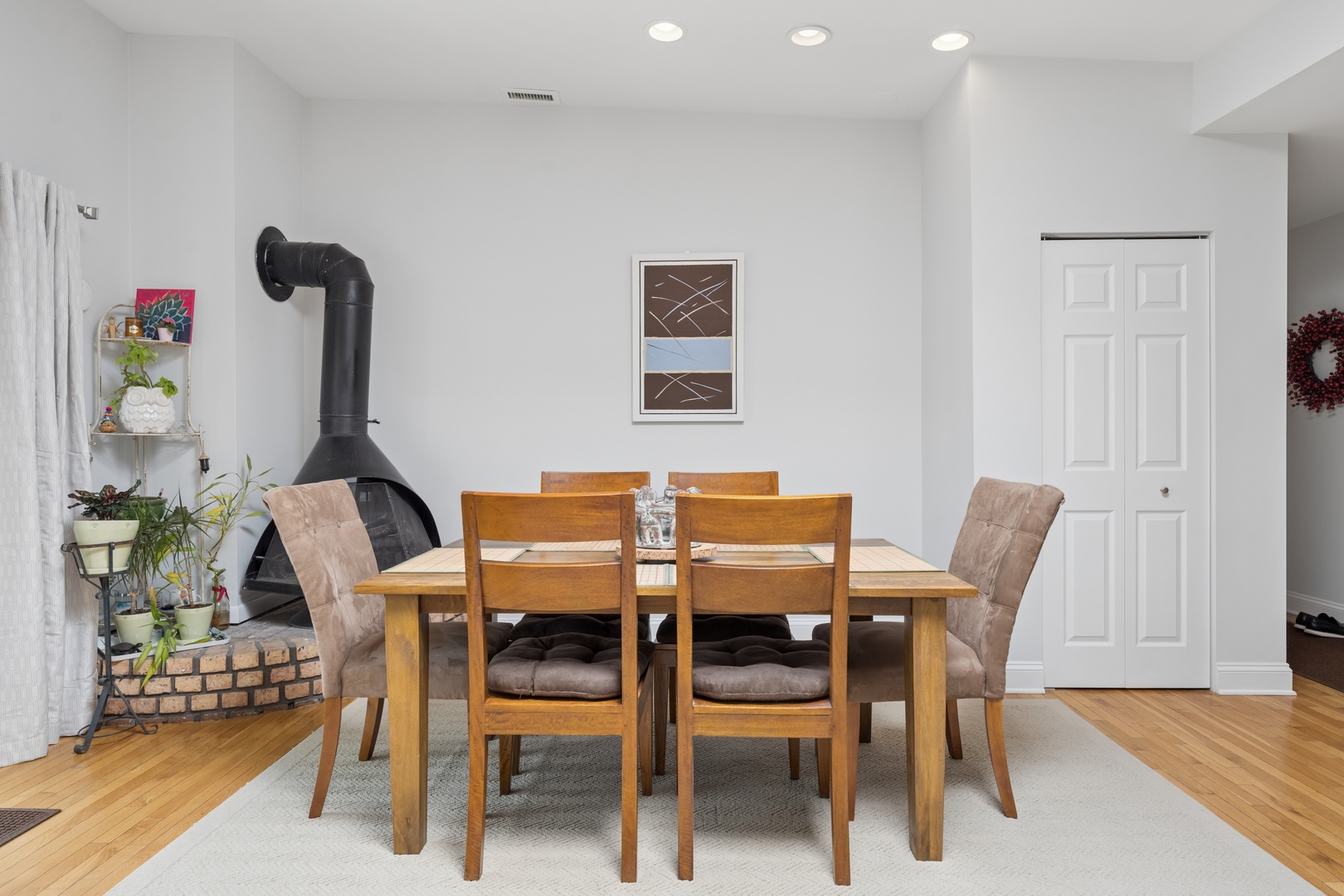 1122 West Altgeld Street, Unit 12 Chicago, IL 60614 - Photo 5 of 20 a view of a dining room with furniture and wooden floor