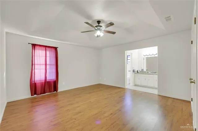 a view of a livingroom with a chandelier fan