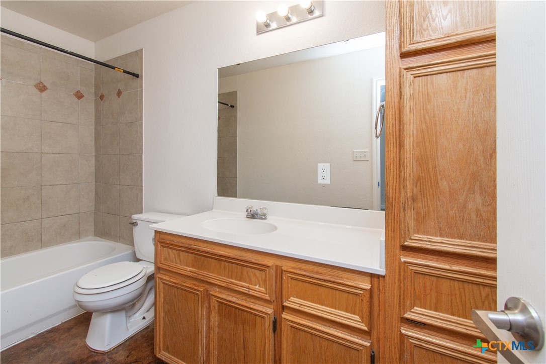 3104 Baldwin Loop, Unit A Killeen, TX 76549 - Photo 18 of 19 a bathroom with a sink a toilet and shower