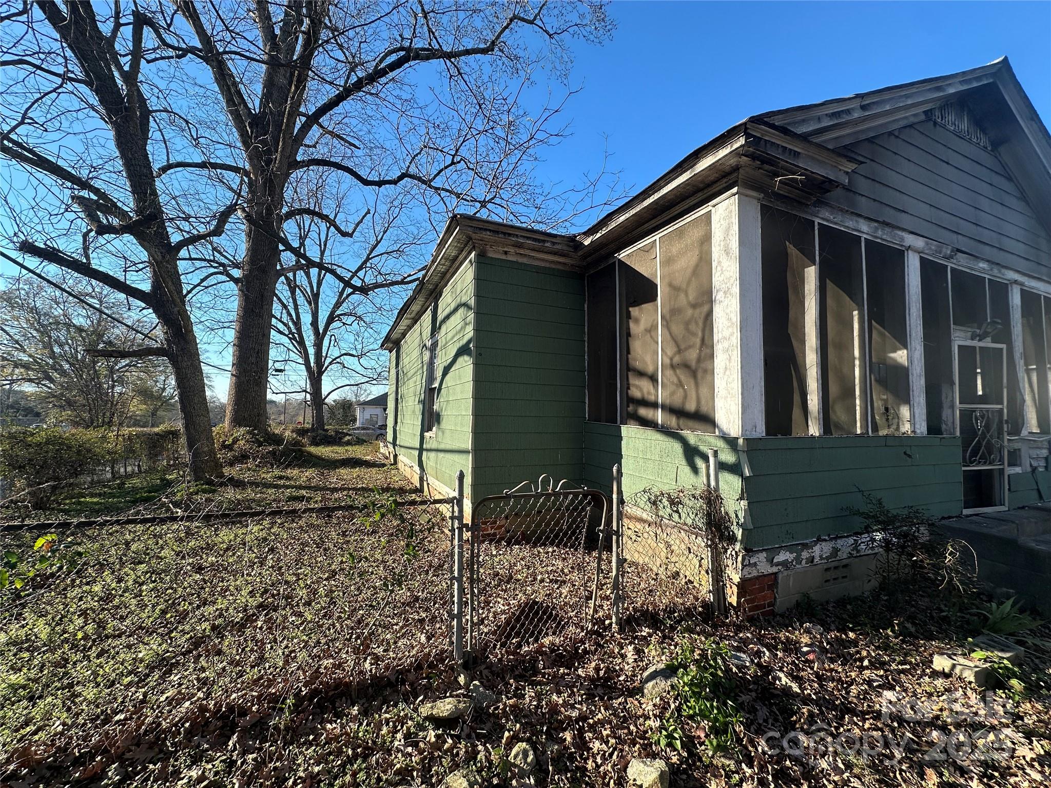 58 Oak Street Great Falls, SC 29055 - Photo 2 of 16 a view of a house that has a small yard and large trees