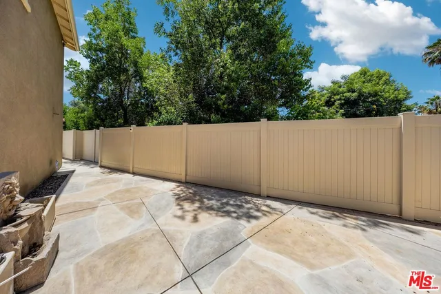 a view of a house with a yard and garage