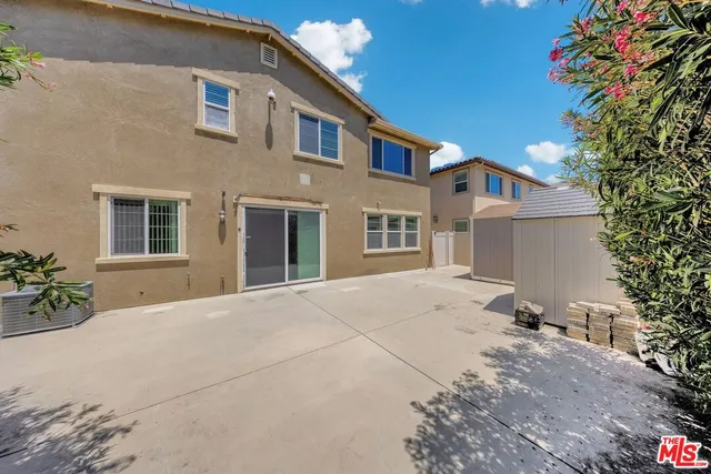 a front view of a house with trees