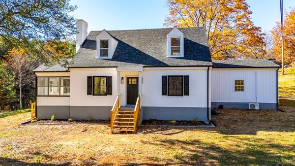 a house with trees in the background