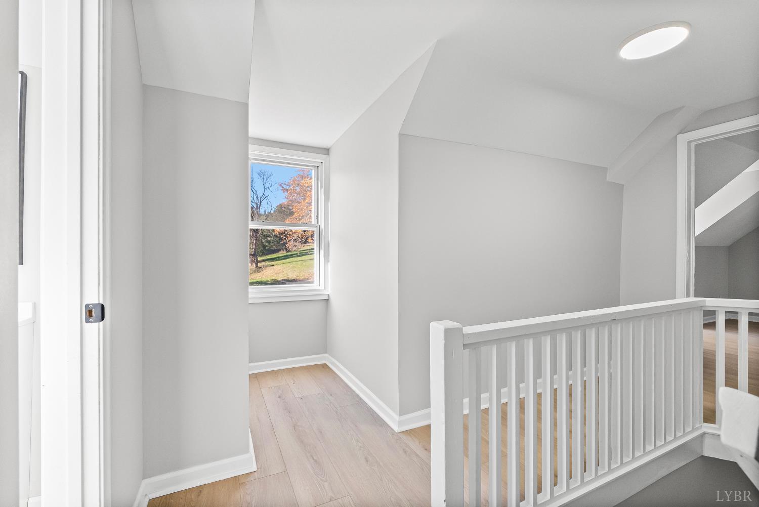 1612 South Amherst Highway Amherst, VA 24521 - Photo 26 of 48 a view of a hallway with wooden floor and a window