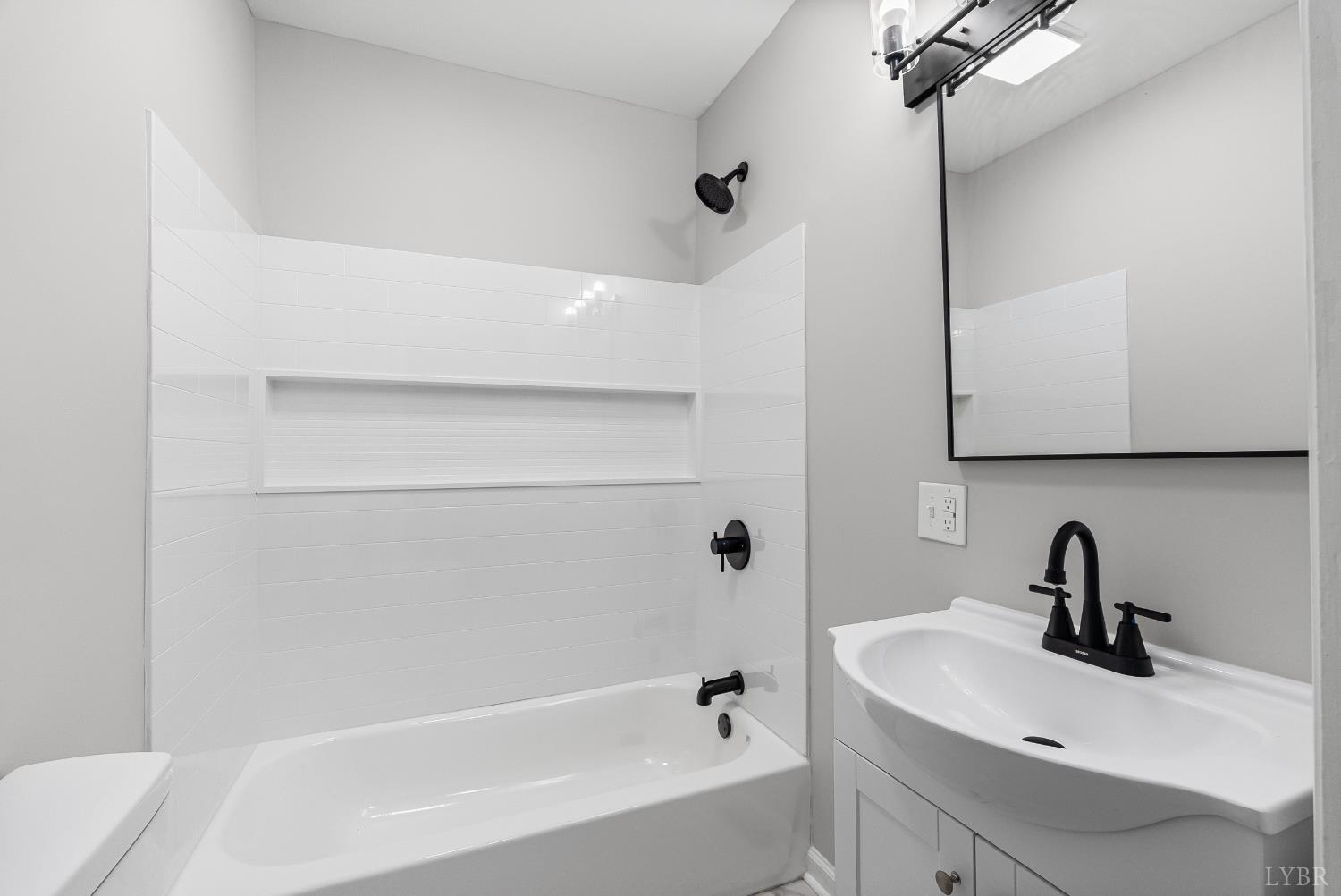 1612 South Amherst Highway Amherst, VA 24521 - Photo 5 of 48 a bathroom with a sink and a bathtub