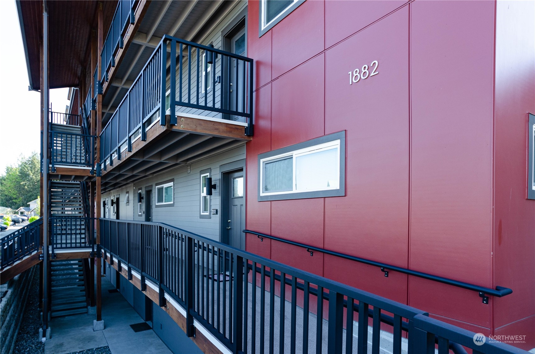 1882 Front Street, Unit 208 Lynden, WA 98264 - Photo 11 of 30 a view of a house with wooden fence