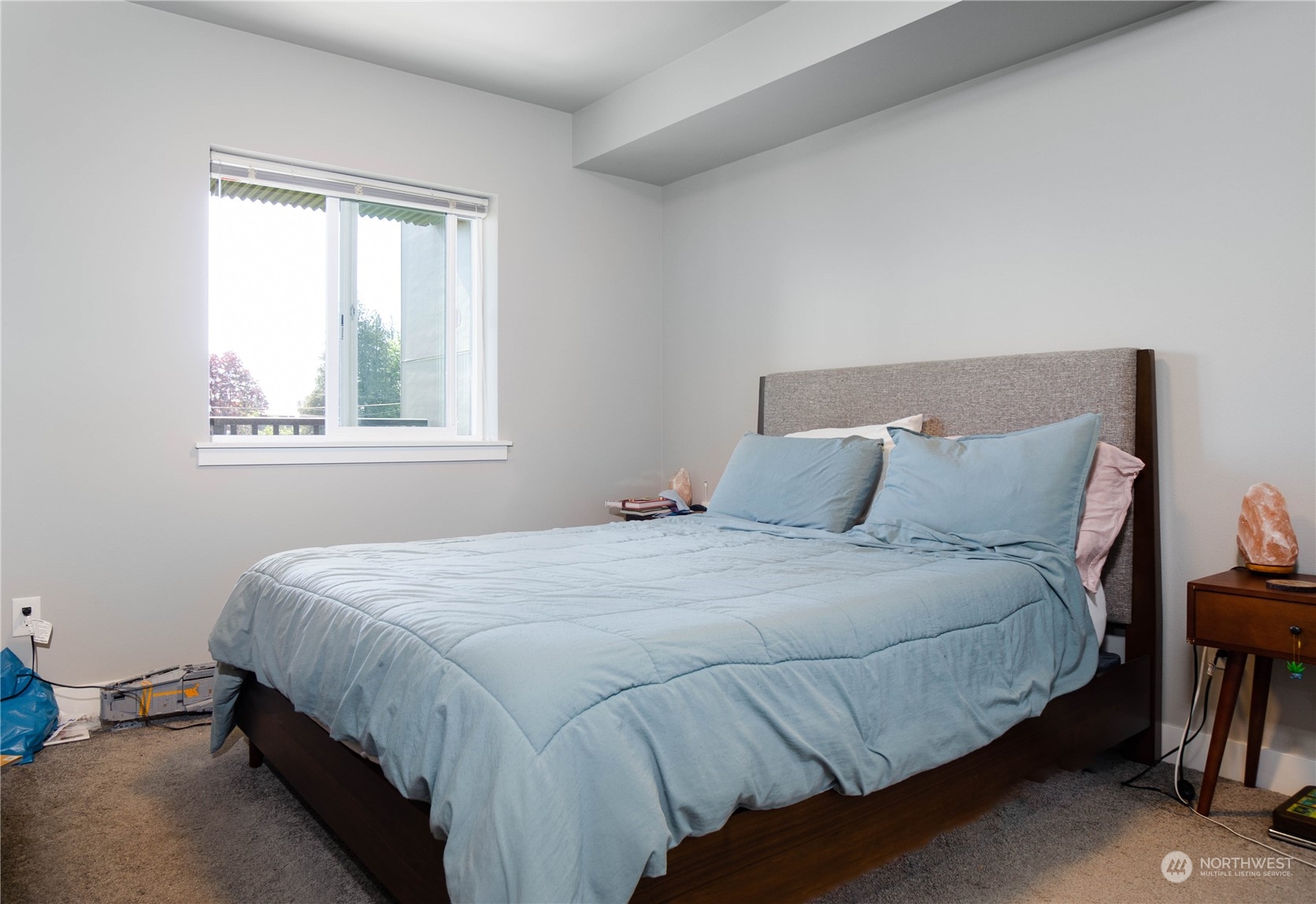 1882 Front Street, Unit 208 Lynden, WA 98264 - Photo 13 of 30 a bed sitting in a bedroom next to a window