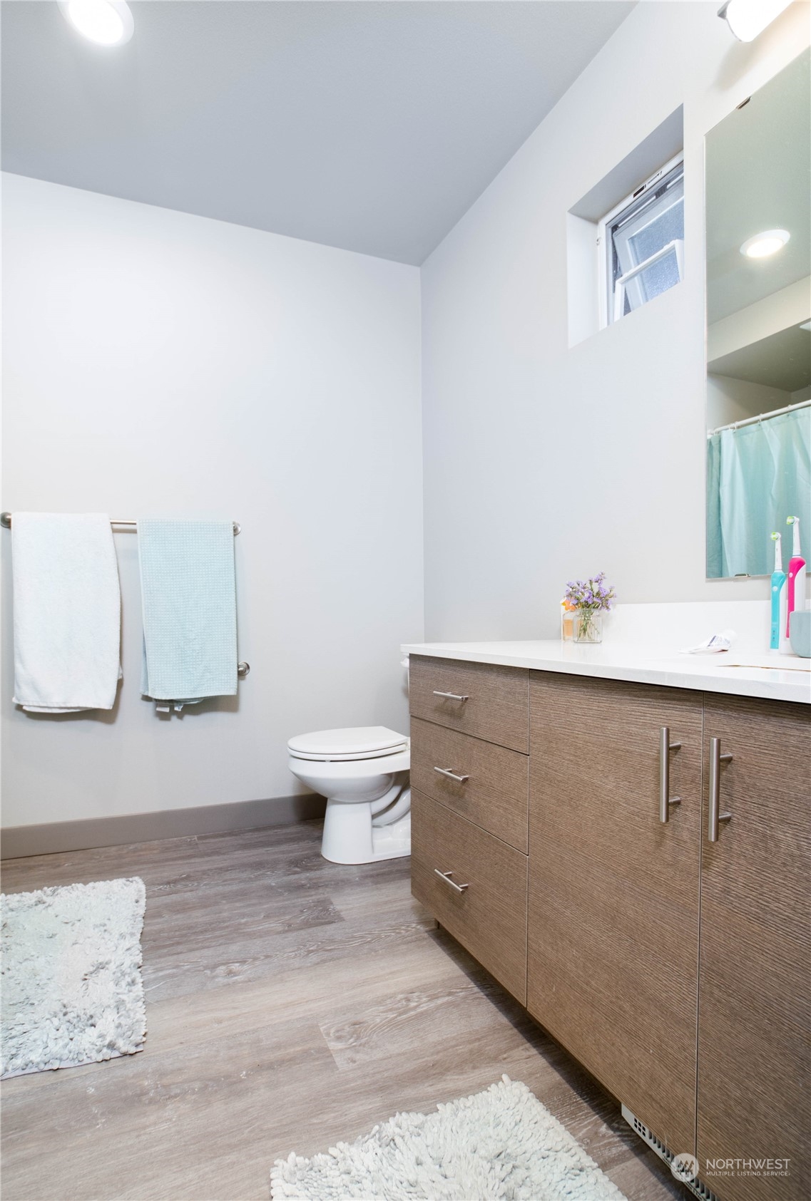 1882 Front Street, Unit 208 Lynden, WA 98264 - Photo 16 of 30 a bathroom with a sink and a mirror