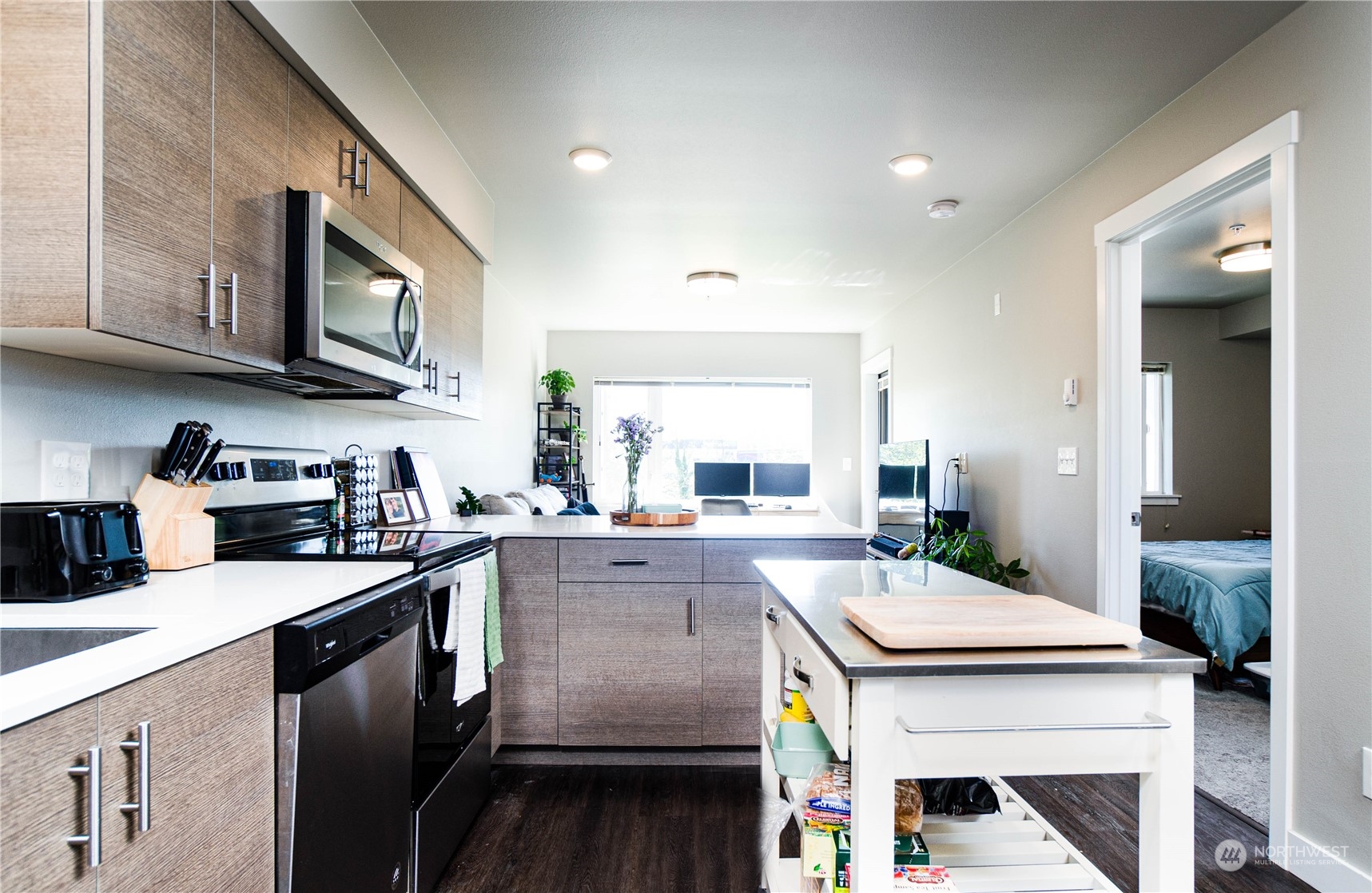 1882 Front Street, Unit 208 Lynden, WA 98264 - Photo 17 of 30 a kitchen with a stove a sink and cabinets