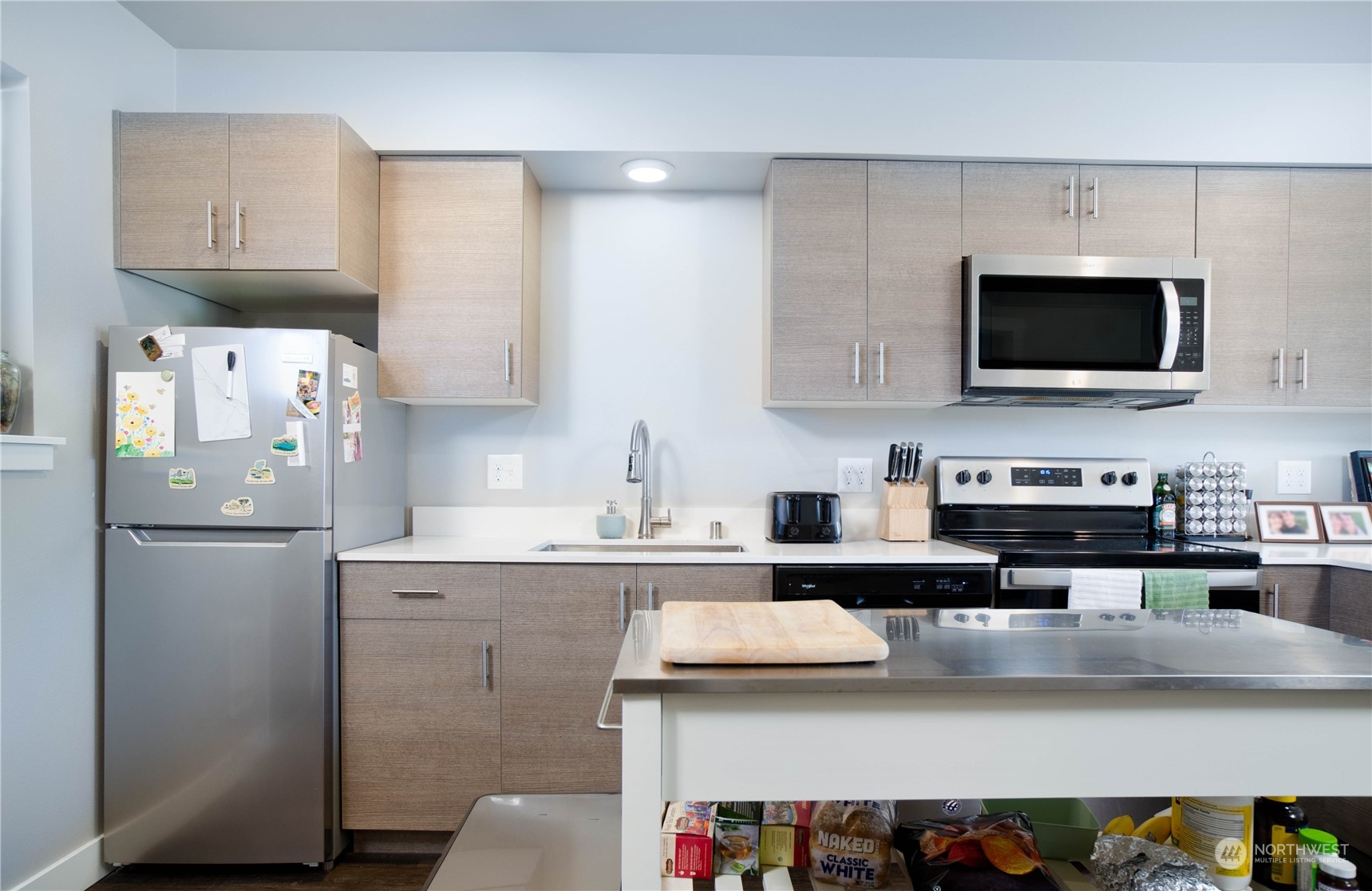 1882 Front Street, Unit 208 Lynden, WA 98264 - Photo 18 of 30 a kitchen with a sink a stove and refrigerator
