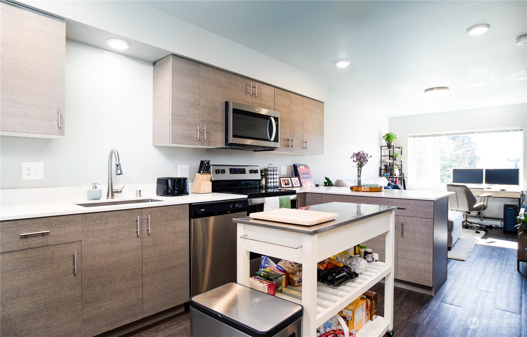 1882 Front Street, Unit 208 Lynden, WA 98264 - Photo 20 of 30 a kitchen with a sink cabinets and wooden floor