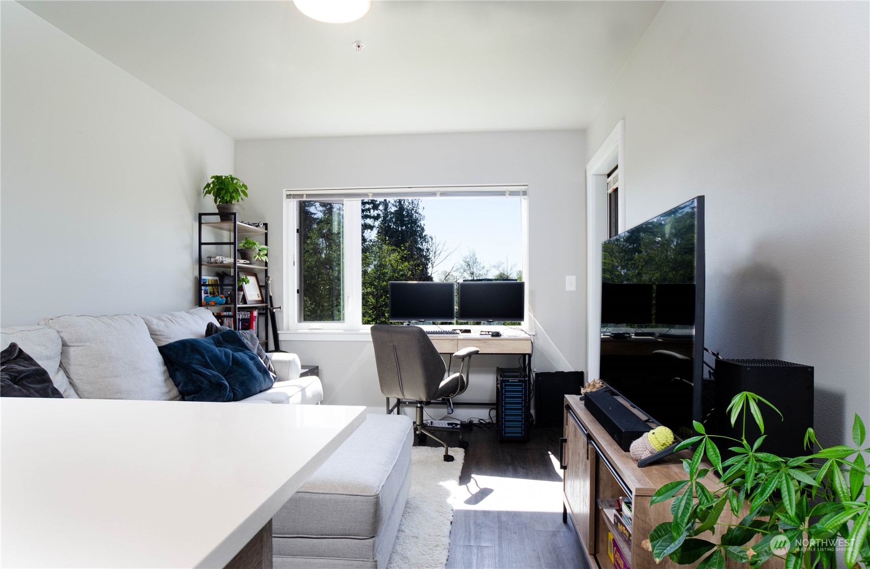 1882 Front Street, Unit 208 Lynden, WA 98264 - Photo 2 of 30 a living room with furniture and a flat screen tv