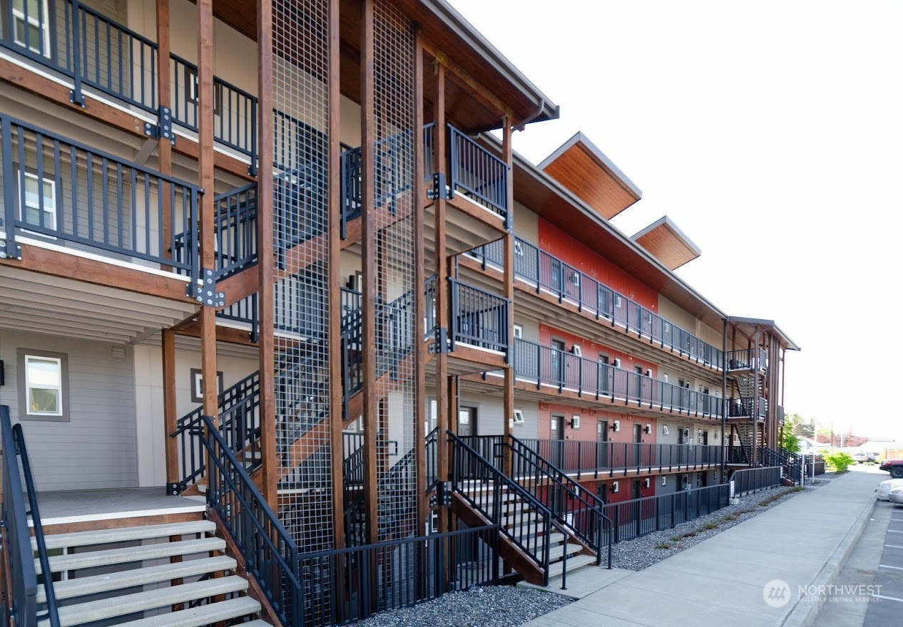 1882 Front Street, Unit 208 Lynden, WA 98264 - Photo 8 of 30 a view of a building with many windows