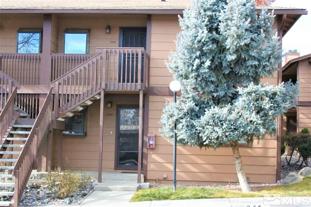2989 Tierra Verde East Reno, NV 89512 - Photo 1 of 18 a front view of a house with street