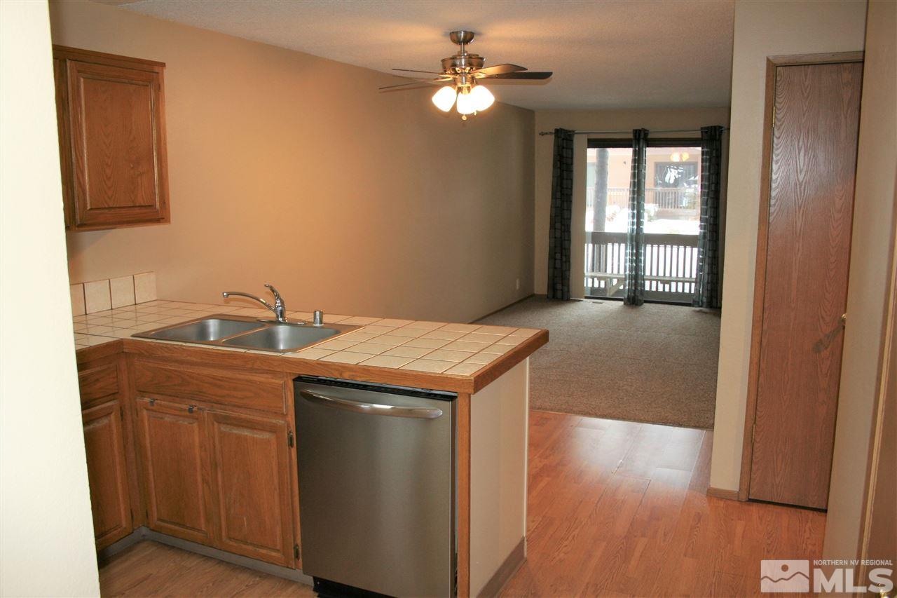 2989 Tierra Verde East Reno, NV 89512 - Photo 2 of 18 a kitchen with a sink and chandelier