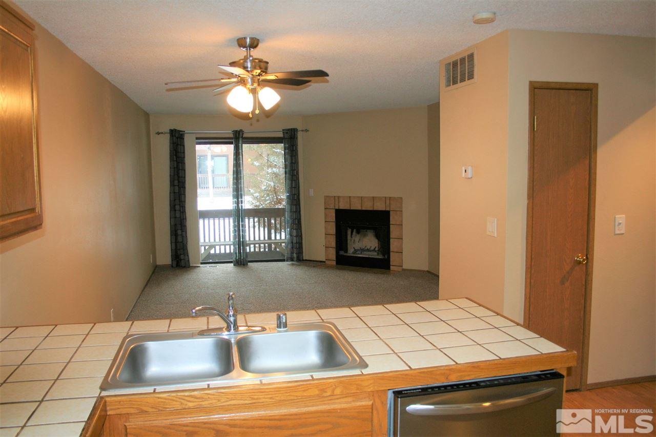 2989 Tierra Verde East Reno, NV 89512 - Photo 3 of 18 a kitchen with a sink and a fireplace
