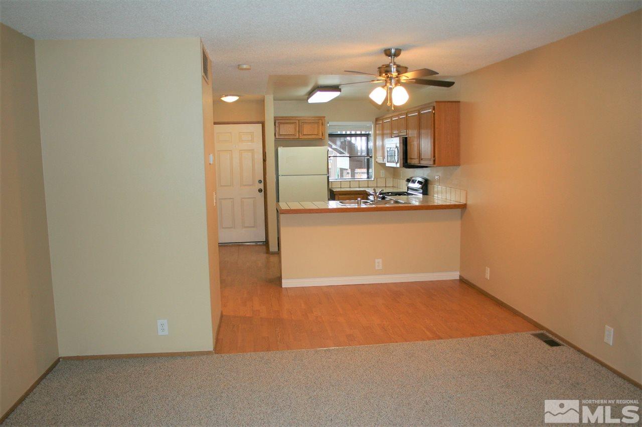 2989 Tierra Verde East Reno, NV 89512 - Photo 6 of 18 a view of a kitchen with a sink and a refrigerator