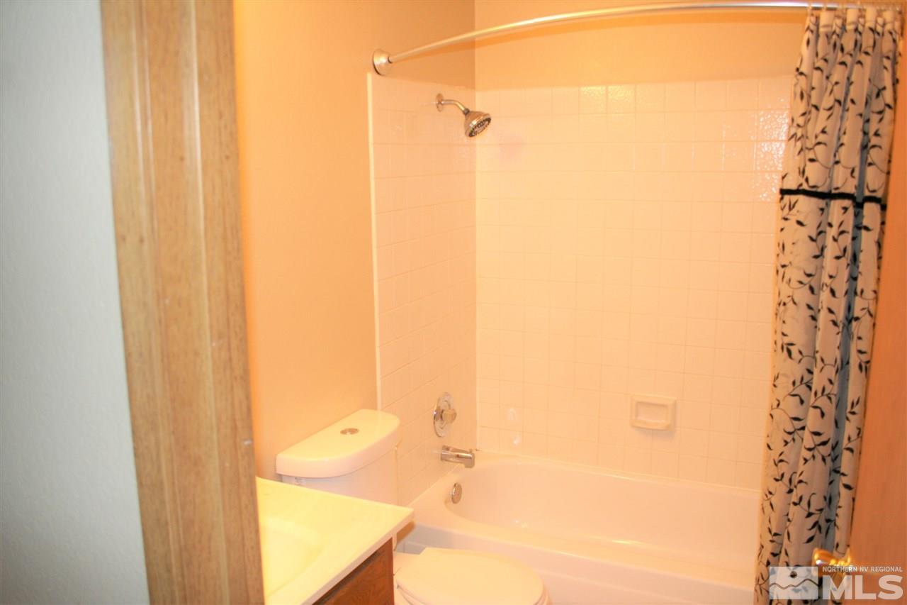 2989 Tierra Verde East Reno, NV 89512 - Photo 8 of 18 a bathroom with a shower