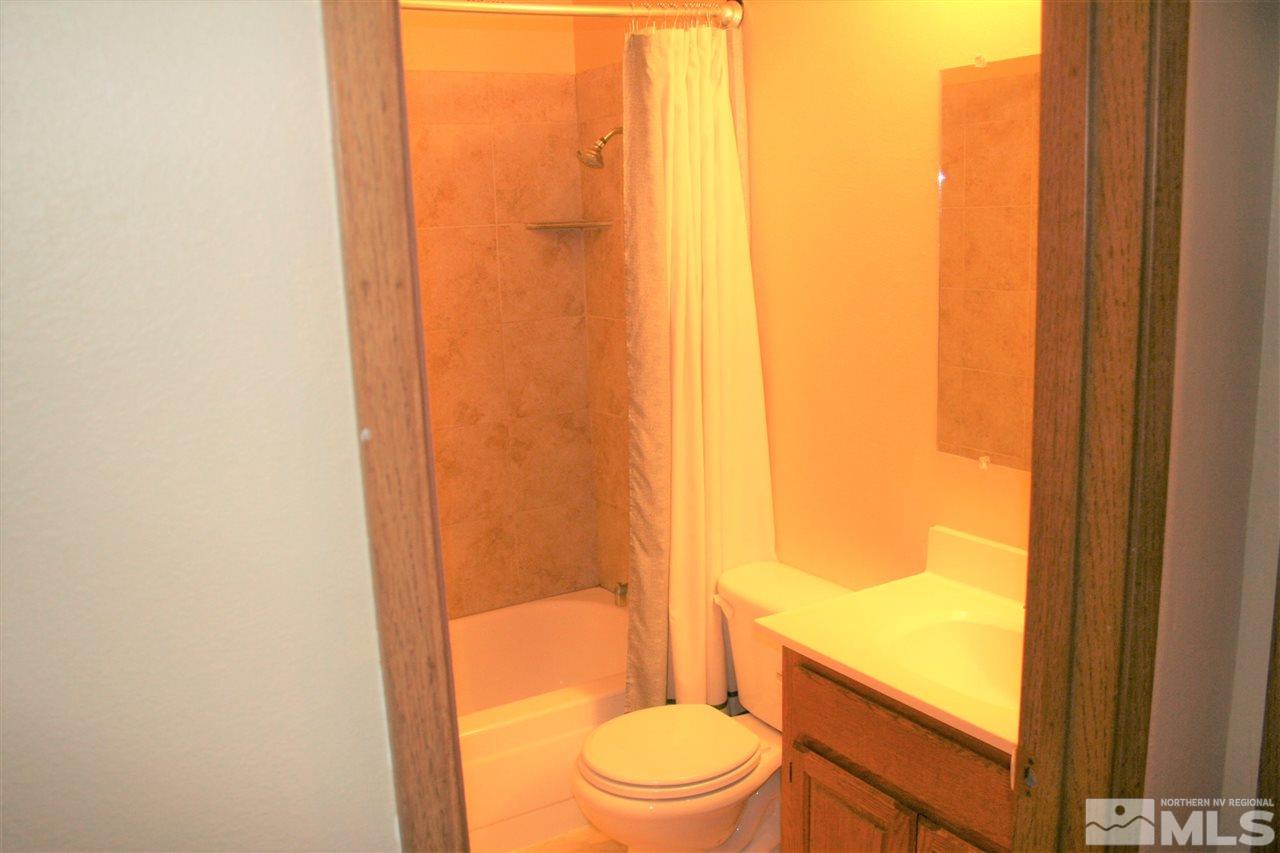 2989 Tierra Verde East Reno, NV 89512 - Photo 9 of 18 a white toilet sitting next to a shower