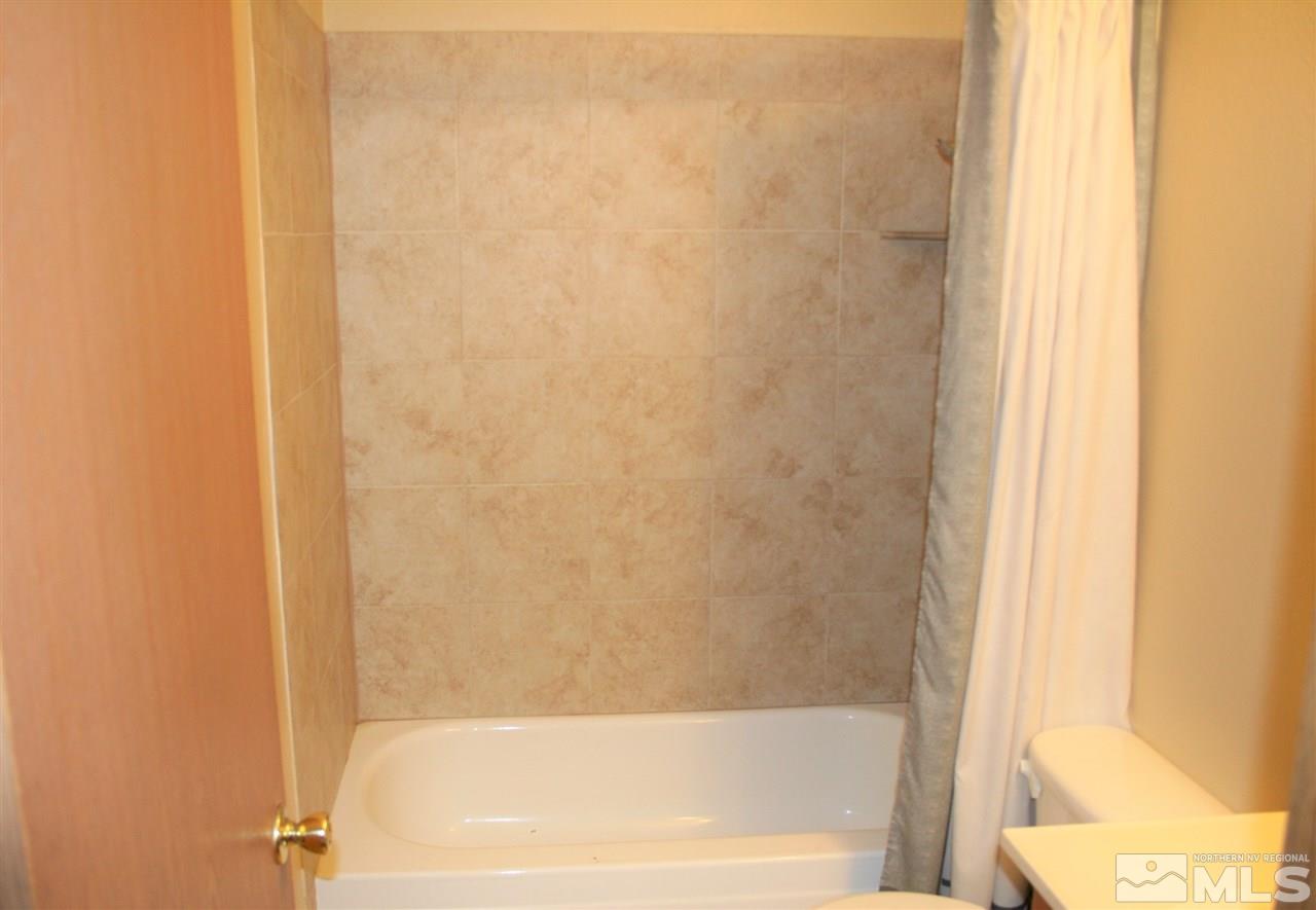 2989 Tierra Verde East Reno, NV 89512 - Photo 10 of 18 a bathroom with a bathtub