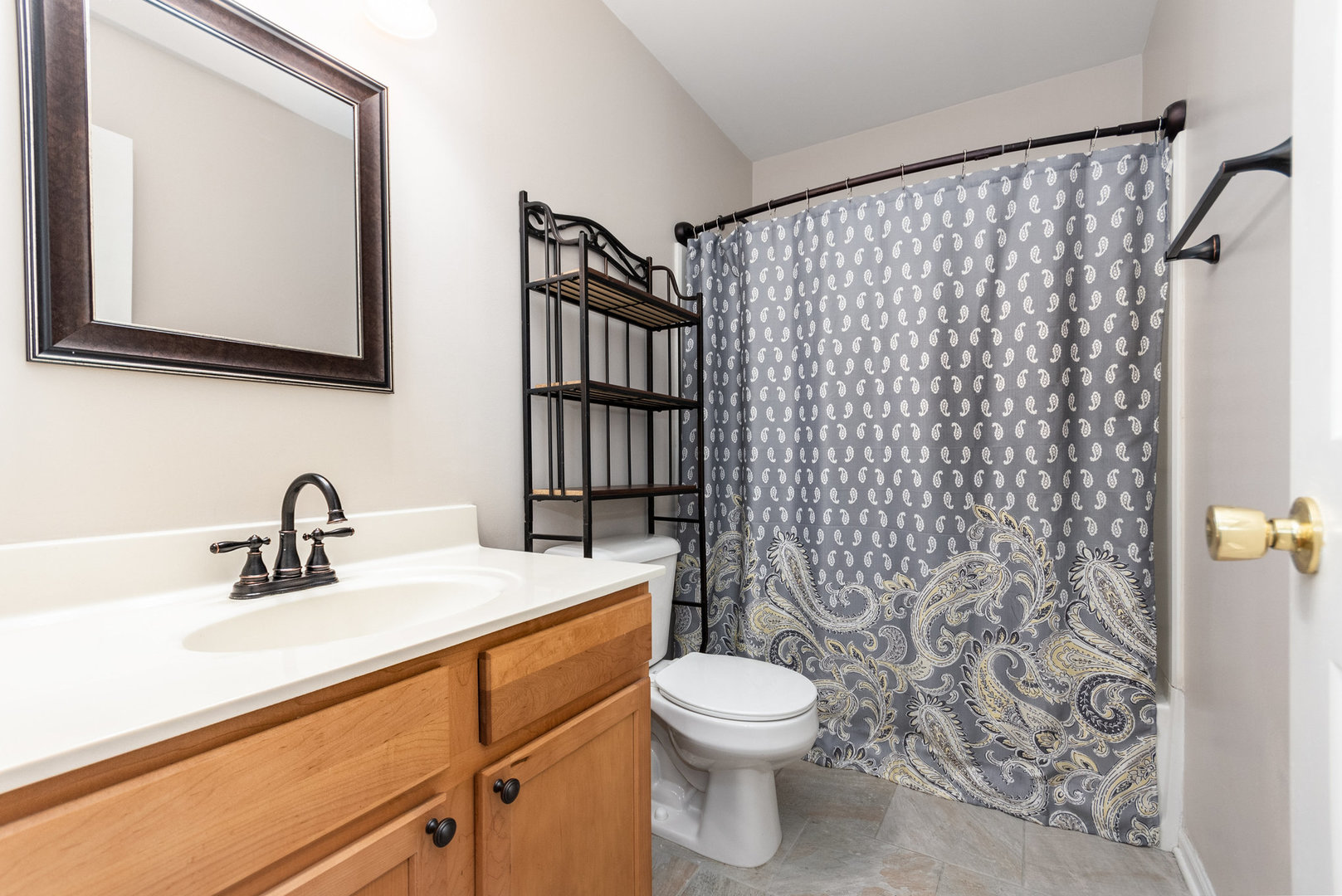 608 Springbrook Trail North Oswego, IL 60543 - Photo 12 of 24 a bathroom with a sink a toilet and shower