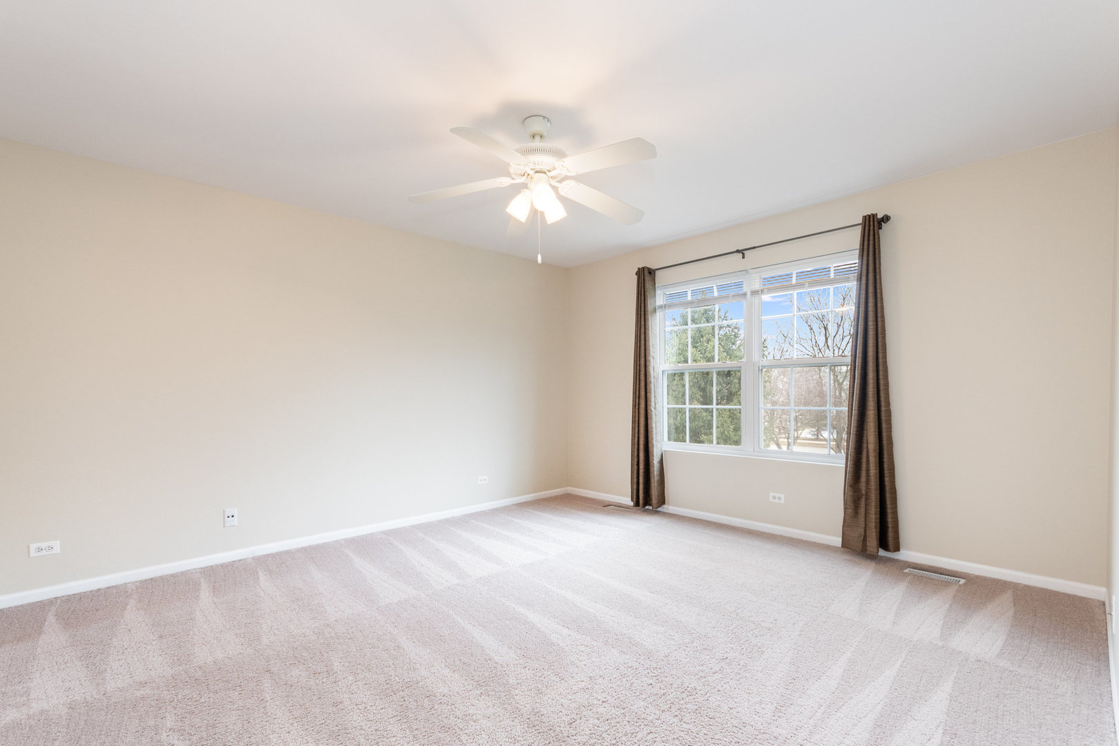 608 Springbrook Trail North Oswego, IL 60543 - Photo 15 of 24 a view of an empty room with a window
