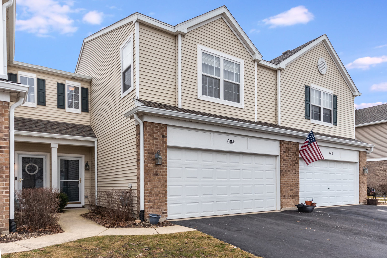 608 Springbrook Trail North Oswego, IL 60543 - Photo 2 of 24 a front view of a house with a yard