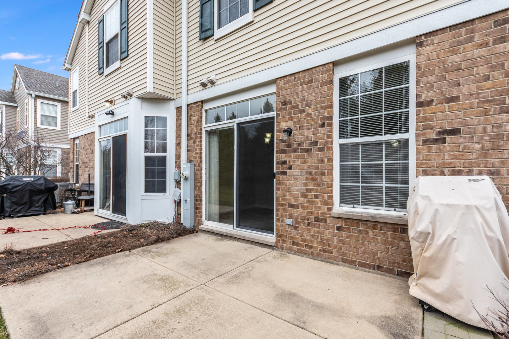 608 Springbrook Trail North Oswego, IL 60543 - Photo 21 of 24 a view of a brick house with many windows