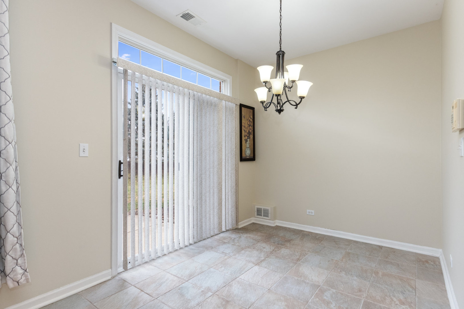 608 Springbrook Trail North Oswego, IL 60543 - Photo 6 of 24 a view of a chandelier in a room and a window