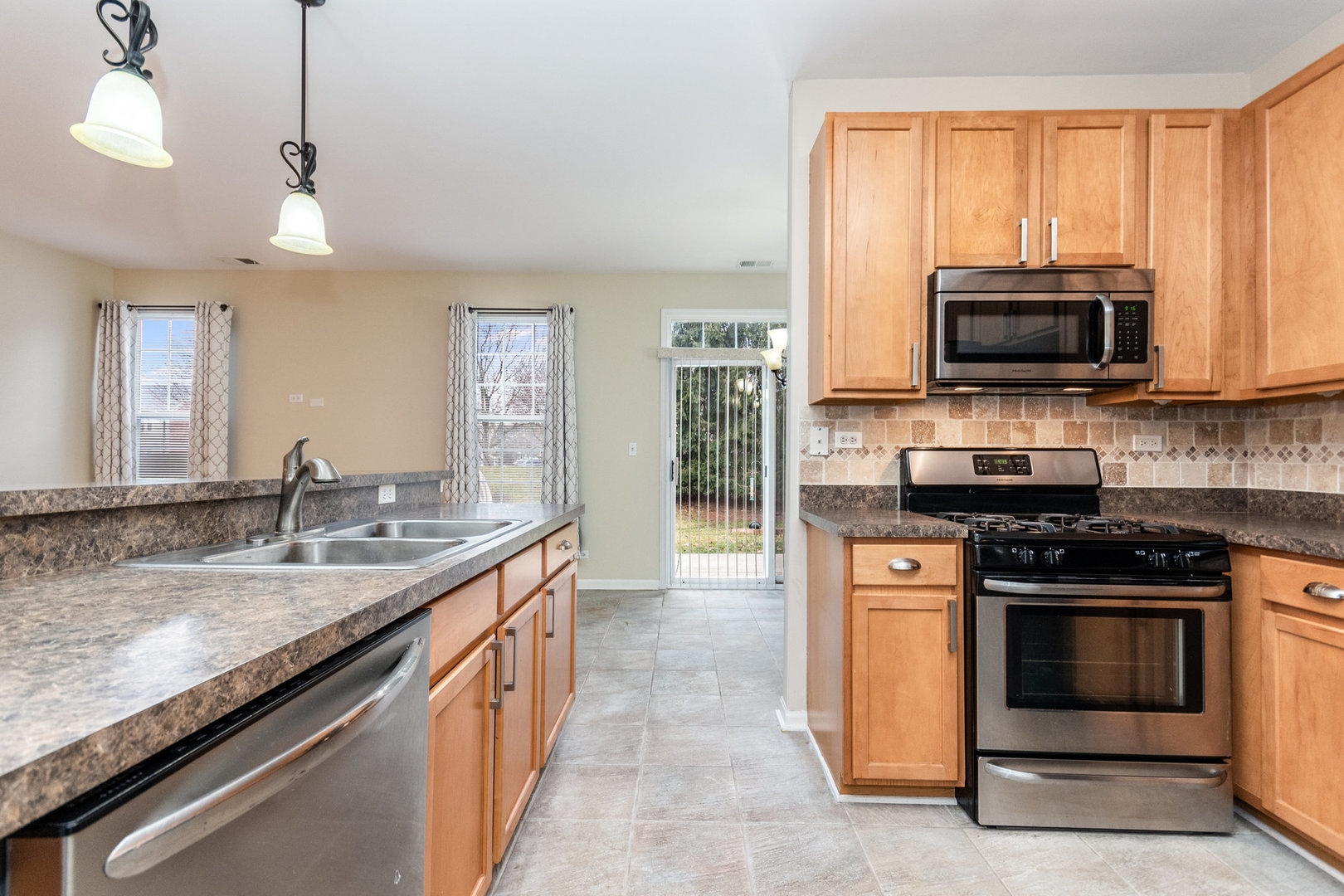 608 Springbrook Trail North Oswego, IL 60543 - Photo 10 of 24 a kitchen with a stove and a sink
