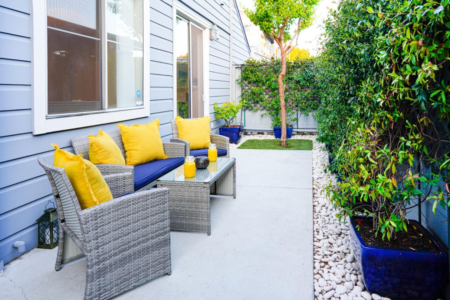 a view of outdoor sitting area with furniture and wooden floor