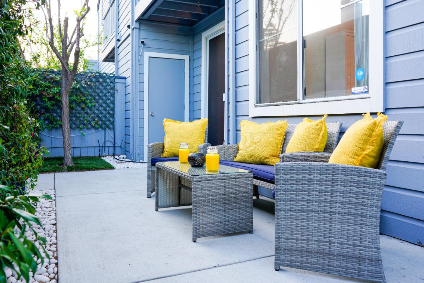 413 Cork Harbour Circle, Unit E Redwood City, CA 94065 - Photo 2 of 23 a building outdoor space with patio furniture