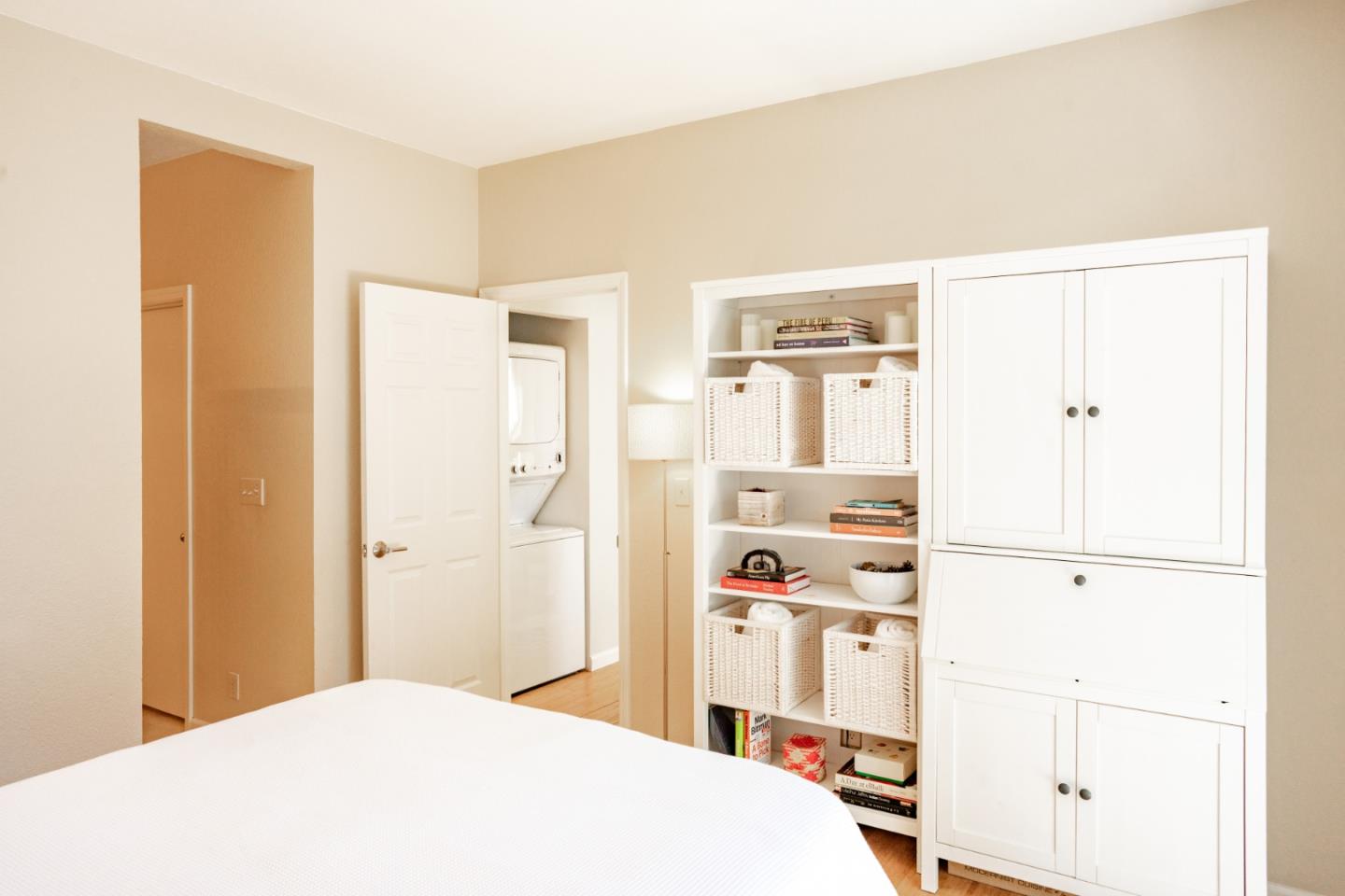 413 Cork Harbour Circle, Unit E Redwood City, CA 94065 - Photo 14 of 23 a bedroom with a bed and a cabinets