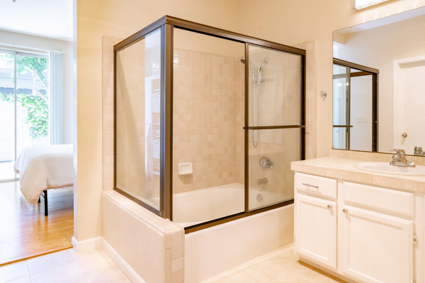 413 Cork Harbour Circle, Unit E Redwood City, CA 94065 - Photo 16 of 23 a bathroom with a shower and a sink