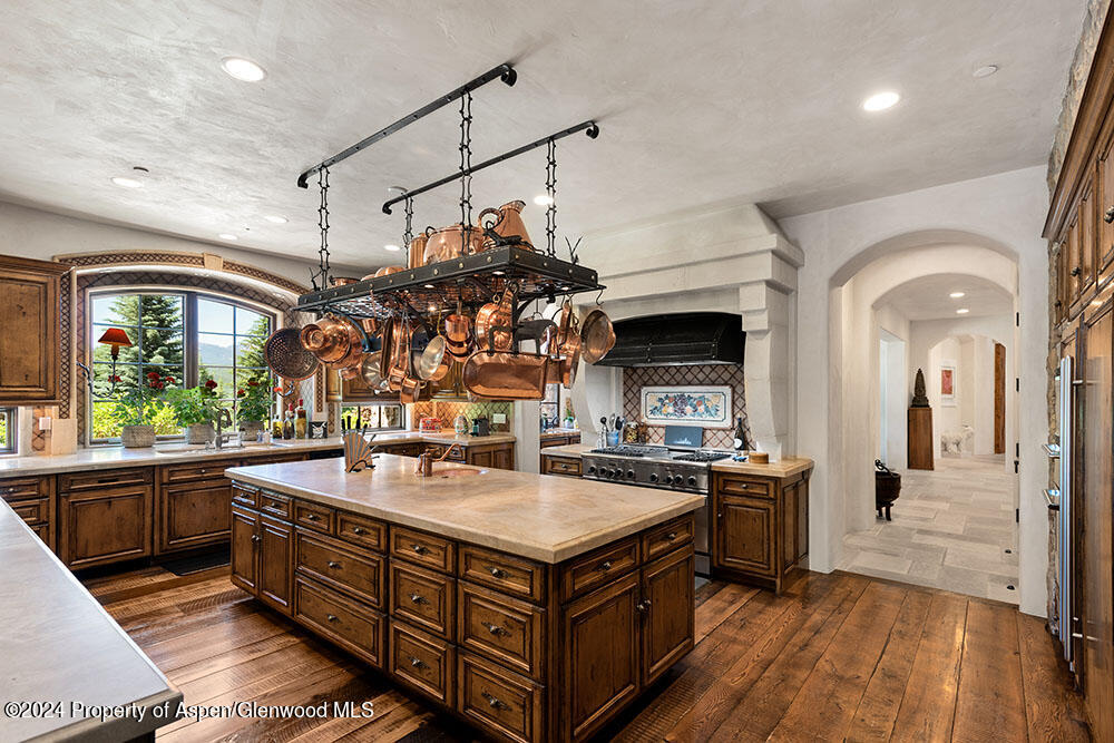 120 Running Mare Road Woody Creek, CO 81656 - Photo 20 of 53 a kitchen with stainless steel appliances granite countertop a sink and a stove