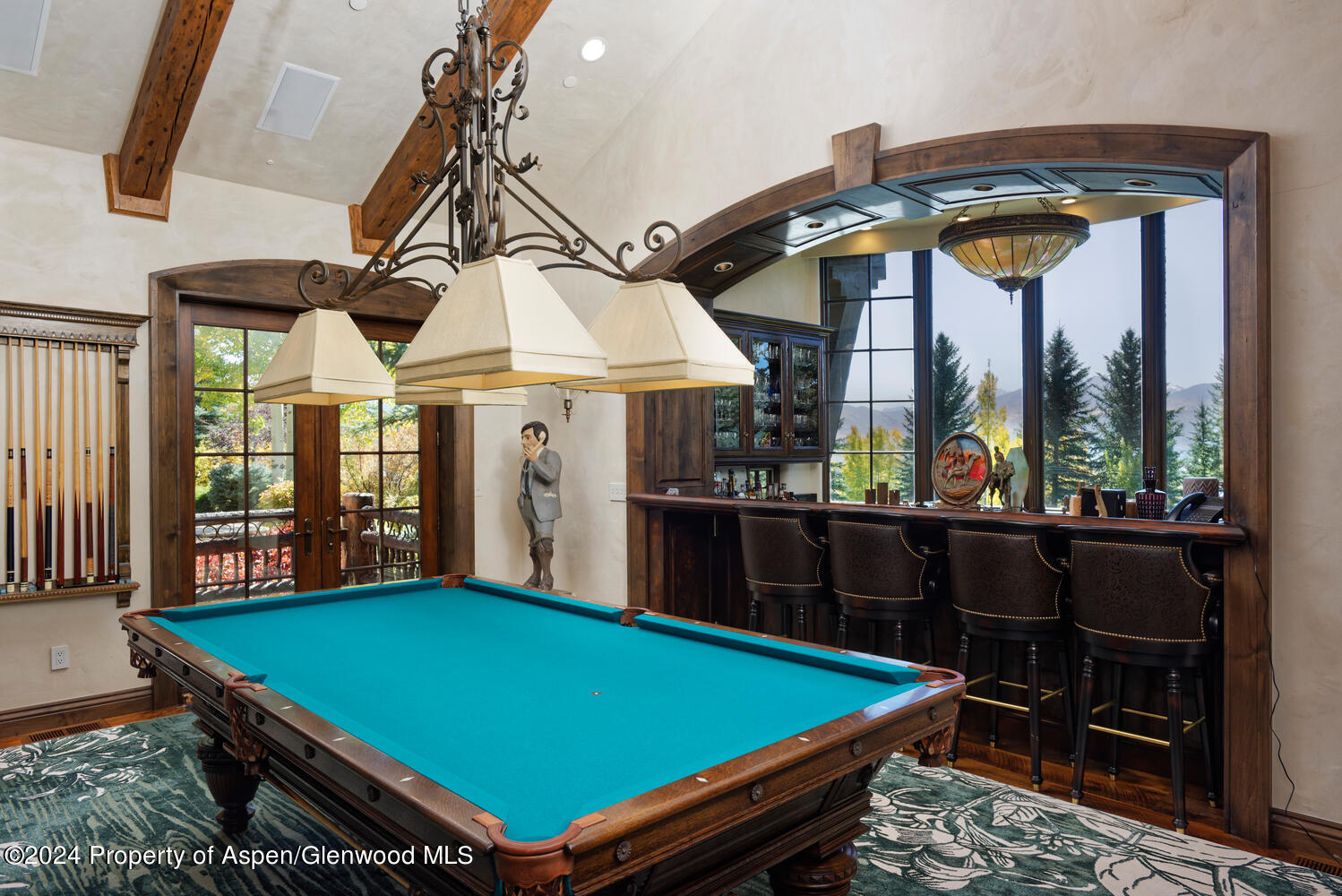 120 Running Mare Road Woody Creek, CO 81656 - Photo 26 of 53 a room with balcony furniture and a floor to ceiling window