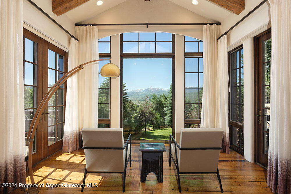 120 Running Mare Road Woody Creek, CO 81656 - Photo 29 of 53 a balcony view with a couch and wooden floor