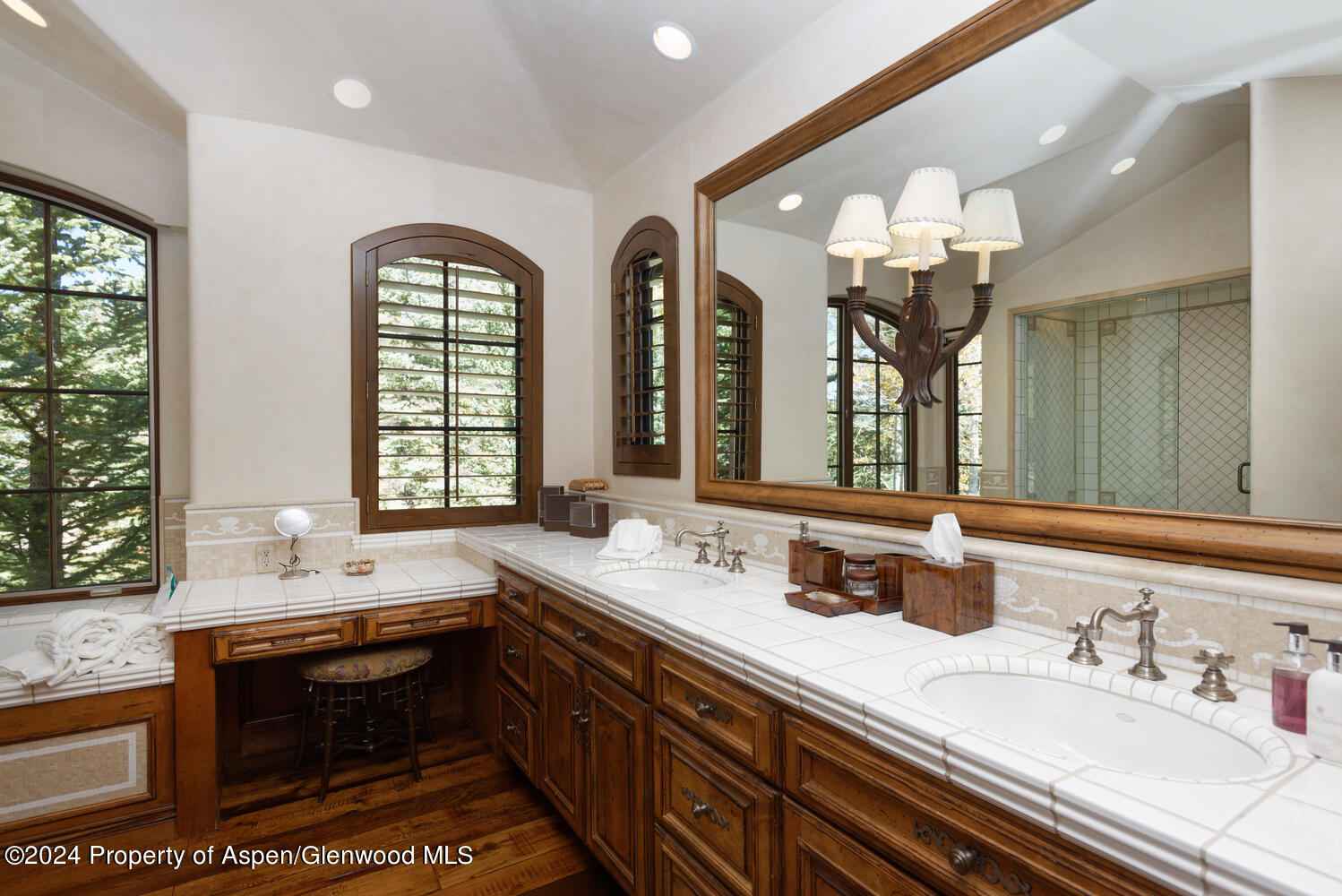 120 Running Mare Road Woody Creek, CO 81656 - Photo 35 of 53 a bathroom with a granite countertop sink a large mirror and a window