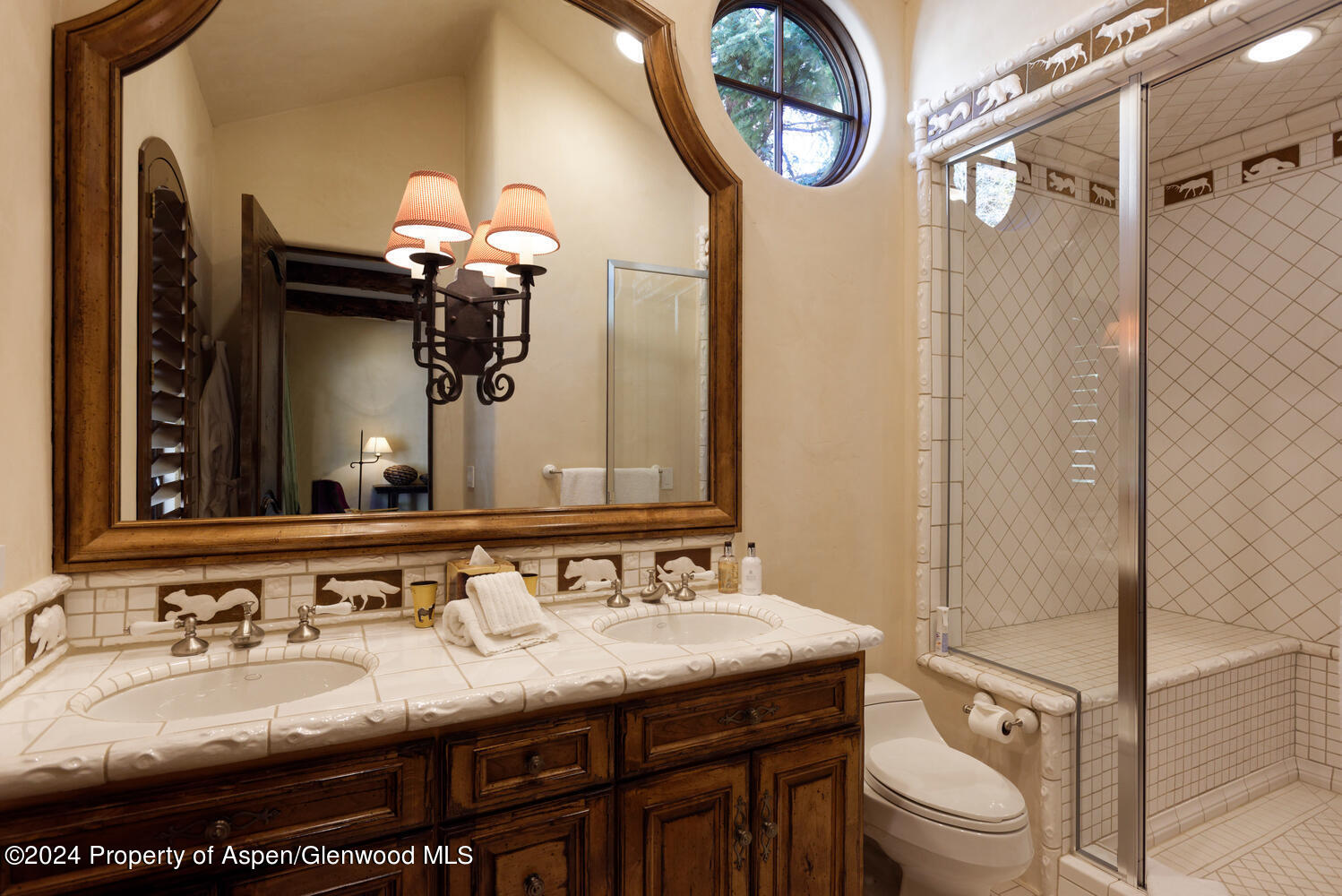 120 Running Mare Road Woody Creek, CO 81656 - Photo 38 of 53 a bathroom with a granite countertop sink a toilet and a mirror