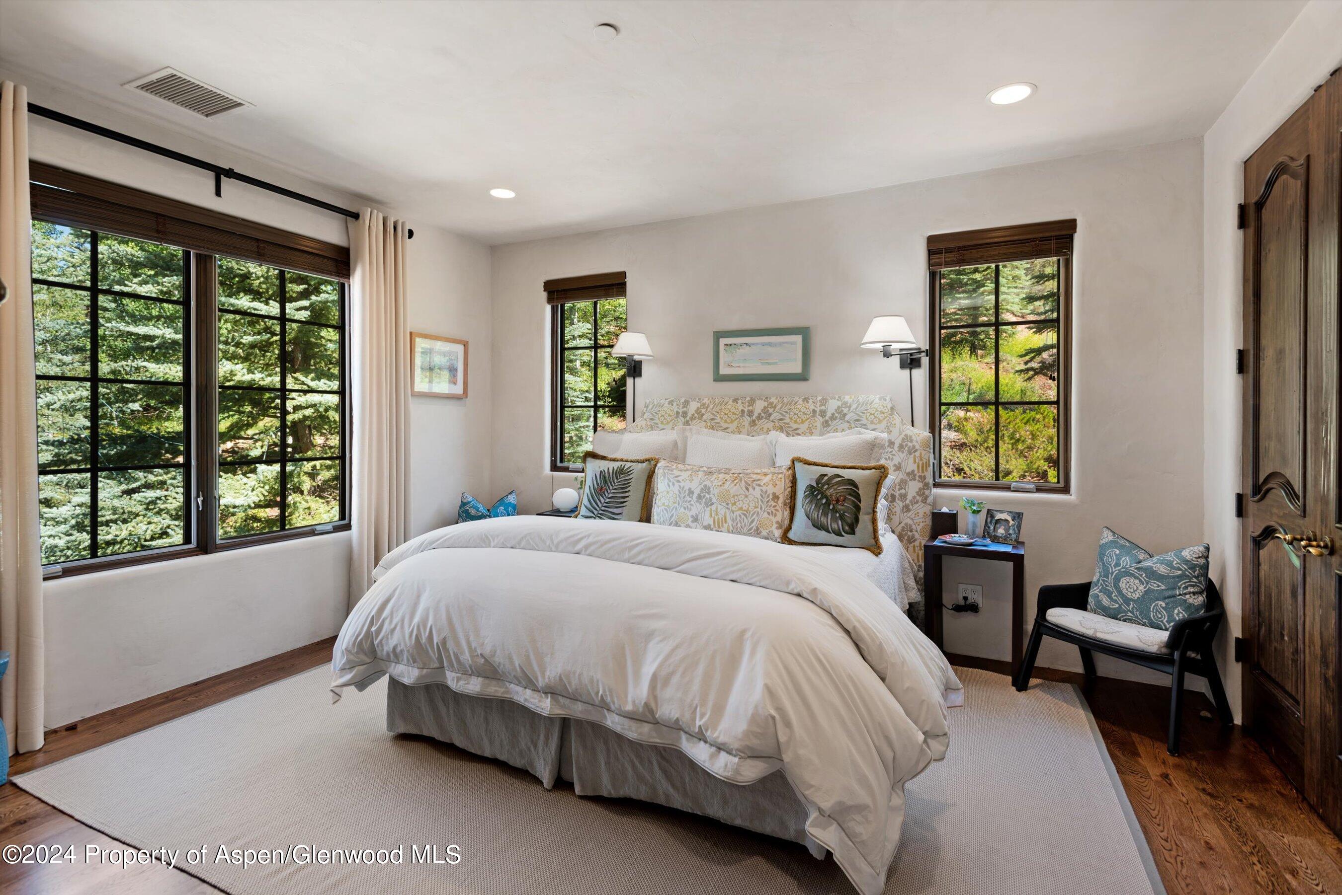 120 Running Mare Road Woody Creek, CO 81656 - Photo 44 of 53 a bedroom with a bed and a window