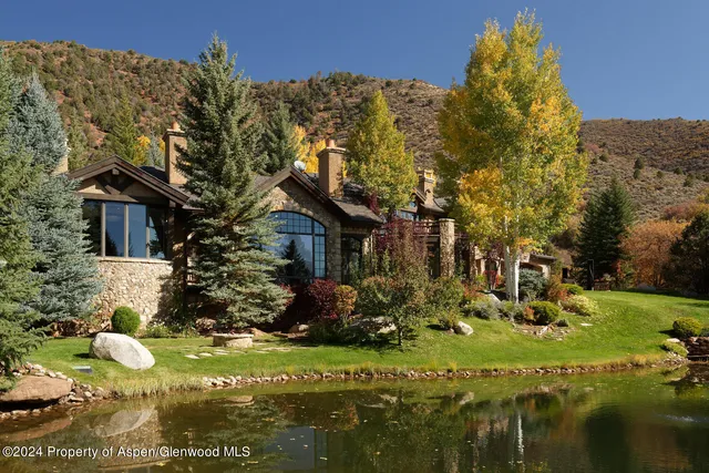 a swimming pool with some trees and plants