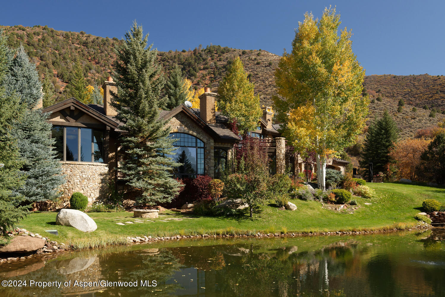 120 Running Mare Road Woody Creek, CO 81656 - Photo 48 of 53 a view of a house with a yard