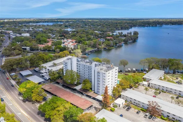 an aerial view of a house with a lake view