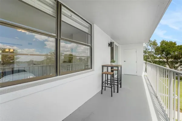 a view of a hallway with seating area